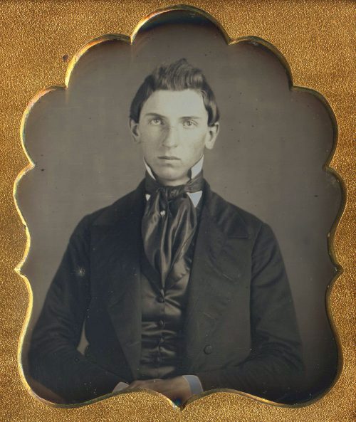 RESIGNED TO HAVE HIS PORTRAIT TAKEN.