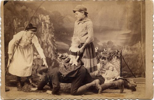 CHILDREN AT PLAY IN STUDIO.