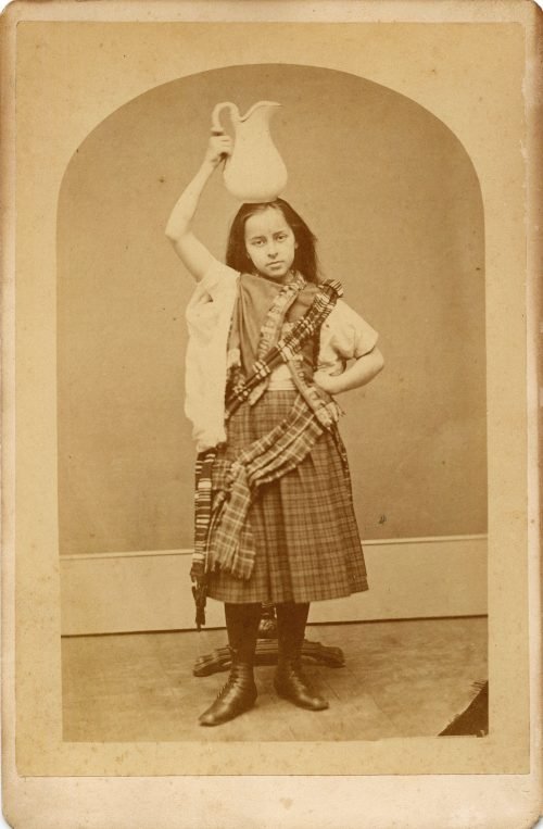 IN TARTAN WITH A PITCHER.