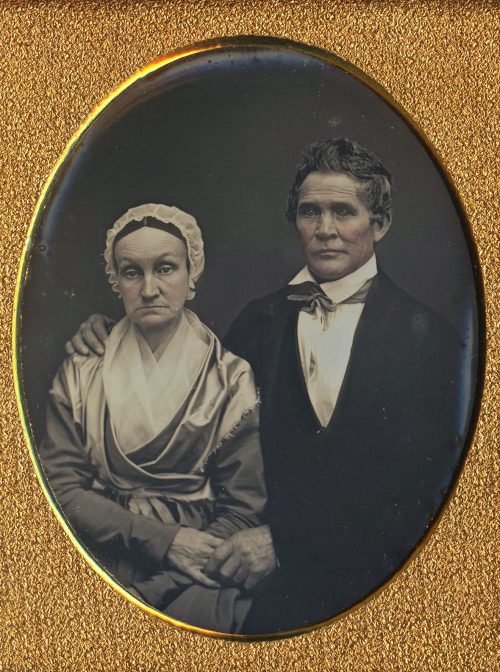 QUAKER COUPLE HOLDING HANDS.