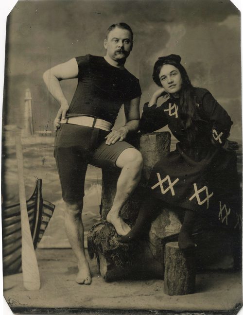 BEACHSIDE PORTRAIT IN BATINGSUIT.