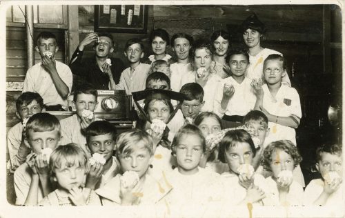 KIDS WATCHING PICTURE SHOW.