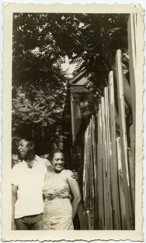DISTRACTED, BUT SMILING, COUPLE.